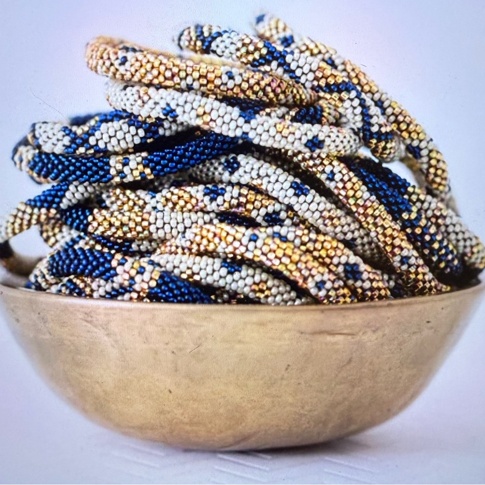 Brand New Set of 4 Aid Through Trade The Original Roll On Bracelet